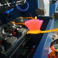 5-axis 3-head machine making goldfish brushes